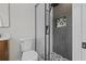 Bathroom featuring a black-framed shower with a rainfall showerhead and a geometric tile accent at 1707 Solon Ave, Dunedin, FL 34698
