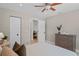 Bedroom with hardwood floors showcasing a dresser, a closet, and an open door to another room at 1707 Solon Ave, Dunedin, FL 34698