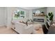 Comfortable living space featuring a modern fireplace, couch, and bright window, creating a welcoming atmosphere at 1707 Solon Ave, Dunedin, FL 34698