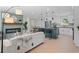 Inviting living area featuring an open concept with modern fireplace, kitchen, and dining area at 1707 Solon Ave, Dunedin, FL 34698