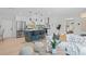 Open-concept living space featuring a kitchen island with bar stools, a cozy living room, and modern decor at 1707 Solon Ave, Dunedin, FL 34698