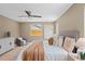 Comfortable main bedroom features natural light, a ceiling fan, and a serene, modern aesthetic at 1707 Solon Ave, Dunedin, FL 34698