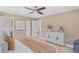 Bright main bedroom showcases calming paint, ceiling fan and ample closet space in a stylish home at 1707 Solon Ave, Dunedin, FL 34698