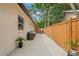 Spacious backyard patio area with dining set and well-maintained fence at 1707 Solon Ave, Dunedin, FL 34698