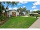 A well-manicured front yard and newly installed wooden fence at 1707 Solon Ave, Dunedin, FL 34698