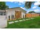 Stepping stones lead to the side entrance of the home adjacent to the yard at 1707 Solon Ave, Dunedin, FL 34698