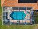 Aerial view of the pool and screened-in patio at 18168 Clearview Dr, Brooksville, FL 34604