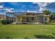 Backyard showcasing a lovely screened-in pool and patio, with plenty of space for outdoor entertaining at 18168 Clearview Dr, Brooksville, FL 34604