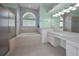 Primary bath featuring a garden tub, glass shower and large vanity at 18168 Clearview Dr, Brooksville, FL 34604