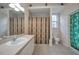 Neutral bathroom featuring a vanity with a sink and a shower-tub with a curtain at 18168 Clearview Dr, Brooksville, FL 34604