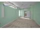 Bedroom with plush carpet, ample natural light, and ensuite bathroom entrance at 18168 Clearview Dr, Brooksville, FL 34604