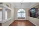Cozy dining area featuring wood floors, a decorative mural, and ample space for Gathering gatherings at 18168 Clearview Dr, Brooksville, FL 34604