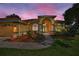 Charming home with inviting curb appeal, lush landscaping, and a well-manicured lawn, creating a warm ambiance at 18168 Clearview Dr, Brooksville, FL 34604