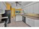 Kitchen with stainless steel appliances and an adjacent dining area at 18168 Clearview Dr, Brooksville, FL 34604