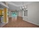 Spacious living room with hardwood floors and access to the pool area at 18168 Clearview Dr, Brooksville, FL 34604