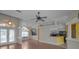 Spacious living room featuring wood floors, ample natural light, and an open layout ideal for entertaining guests at 18168 Clearview Dr, Brooksville, FL 34604