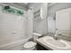 Full bathroom featuring a shower and tub combo, and vanity at 18203 Tivoli Ln, Lutz, FL 33558