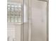 Enclosed shower next to a tub with glass block window in a well-lit bathroom at 18203 Tivoli Ln, Lutz, FL 33558