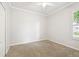 Bedroom features carpet floors, and shuttered windows at 18203 Tivoli Ln, Lutz, FL 33558