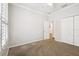 Bright bedroom with neutral walls, crown molding, carpet flooring, and closet at 18203 Tivoli Ln, Lutz, FL 33558