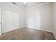 Cozy bedroom with neutral walls, carpet flooring, and double door closet at 18203 Tivoli Ln, Lutz, FL 33558