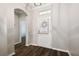 Inviting entryway with wood flooring and a sidelight front door at 18203 Tivoli Ln, Lutz, FL 33558