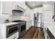Modern kitchen with stainless steel appliances and marble countertops at 18203 Tivoli Ln, Lutz, FL 33558