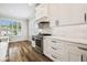 Elegant kitchen showcasing stainless steel appliances and bright white cabinets at 18203 Tivoli Ln, Lutz, FL 33558