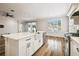 Gourmet kitchen featuring a large island and modern stainless steel appliances at 18203 Tivoli Ln, Lutz, FL 33558