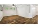 Living room with hardwood floors, a ceiling fan, and plenty of natural light at 18203 Tivoli Ln, Lutz, FL 33558