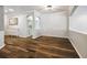 Spacious living room with elegant hardwood floors and decorative archways at 18203 Tivoli Ln, Lutz, FL 33558