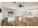 Expansive living area with sliding glass doors and a view of the pool at 18203 Tivoli Ln, Lutz, FL 33558
