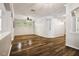 Spacious living room with hardwood floors, neutral walls, and ample natural light at 18203 Tivoli Ln, Lutz, FL 33558