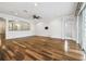 Spacious living area featuring wood floors, white trim, recessed lights, and natural light at 18203 Tivoli Ln, Lutz, FL 33558