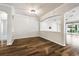 Spacious living area features hardwood floors and views to the outdoors at 18203 Tivoli Ln, Lutz, FL 33558