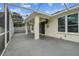 Covered patio with ample space for relaxing and entertaining, seamlessly connects to the indoor living area at 18203 Tivoli Ln, Lutz, FL 33558