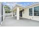 Spacious, screened patio offers a comfortable spot to unwind and enjoy the backyard view, adding extra living space at 18203 Tivoli Ln, Lutz, FL 33558