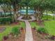 Picturesque view of a community pavilion, framed by lush greenery and trees, offering a tranquil gathering space at 18203 Tivoli Ln, Lutz, FL 33558