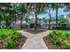 Charming community pavilion nestled amongst mature trees and landscaping, accessible via a brick pathway at 18203 Tivoli Ln, Lutz, FL 33558