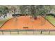 Aerial view of a well-maintained playground with swings, slides, and climbing structures for children at 18203 Tivoli Ln, Lutz, FL 33558