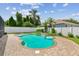 Backyard pool with brick paver deck, spa and privacy fence at 18203 Tivoli Ln, Lutz, FL 33558