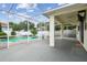 View of the pool and outdoor living space with screened enclosure at 18203 Tivoli Ln, Lutz, FL 33558