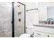 Bathroom showcasing a glass-enclosed shower, modern fixtures, and granite counters at 18527 Cortes Creek Blvd, Spring Hill, FL 34610