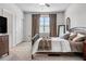 Bedroom with neutral walls, carpet, natural light, and a walk-in closet at 18527 Cortes Creek Blvd, Spring Hill, FL 34610