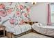 Bedroom featuring twin beds, storage drawers, floral wallpaper, and a ceiling fan at 18527 Cortes Creek Blvd, Spring Hill, FL 34610