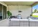 Covered outdoor patio featuring comfortable seating and serene outdoor views at 18527 Cortes Creek Blvd, Spring Hill, FL 34610