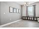 Well-organized playroom featuring storage bins, a modern light fixture and playful wall art at 18527 Cortes Creek Blvd, Spring Hill, FL 34610