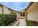 Inviting walkway to front door with beautiful landscaping at 1902 Elaine Dr, Clearwater, FL 33760