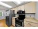 Updated kitchen showcases stainless steel appliances and abundant cabinet space at 1902 Elaine Dr, Clearwater, FL 33760