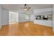 Hardwood floors throughout the living room connecting to the kitchen at 1902 Elaine Dr, Clearwater, FL 33760